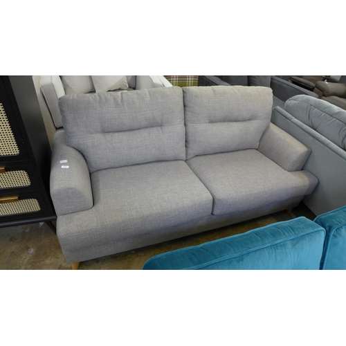 1427 - A taupe upholstered two seater sofa