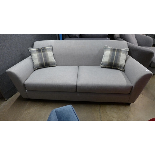 1458 - A grey stone three seater sofa