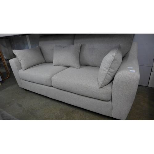 1460 - A light stone two seater sofa