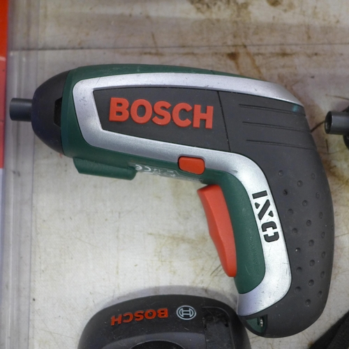 2052 - Two Bosch cordless OX1 screwdriver drills