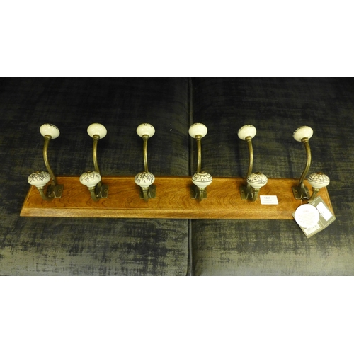 1327 - A rack of six coat hooks with ceramic knobs (HH574624)   #