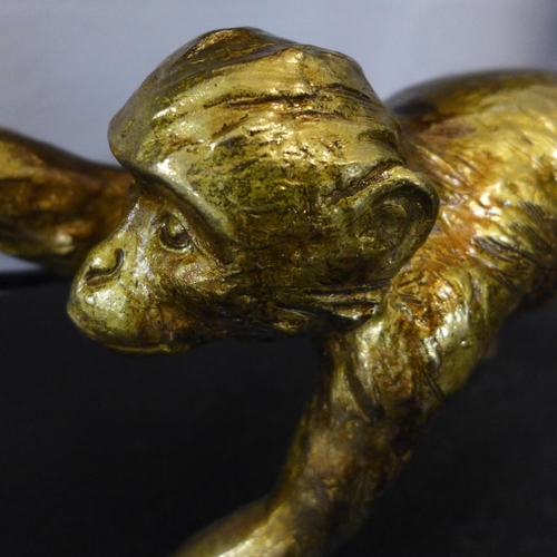 1330 - A gold crawling monkey lamp