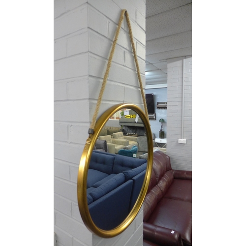 1401 - A large gold metal mirror on hanging rope, 58cms (JRG1114)   #