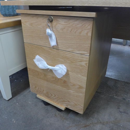 1490 - A large oak effect desk with two drawer locking cabinet * this lot is subject to VAT