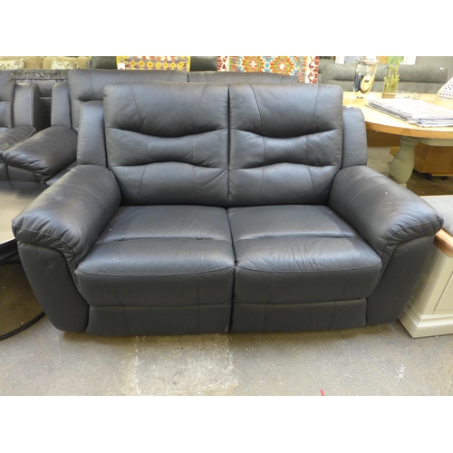 1516 - A black leather pair of two and three seater sofas * this lot is subject to VAT