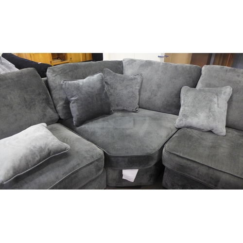 1523 - A Halley charcoal upholstered curved LHF corner sofa with ottoman footstool