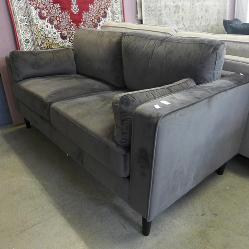 1576 - An ash grey velvet two seater sofa