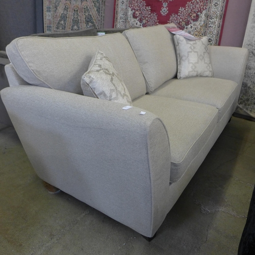 1580 - A clay grey fabric 3 seater sofa