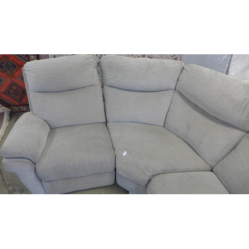 1598 - A grey sectional corner sofa, worn and marked