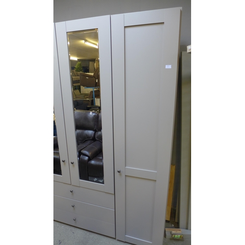 1603 - A large grey 4 door, 3 drawer floor standing wardrobe *This lot is subject to VAT