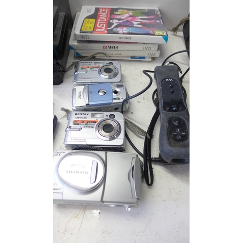 2313 - Wii console with bag of digital cameras, phones and Sat Nav units