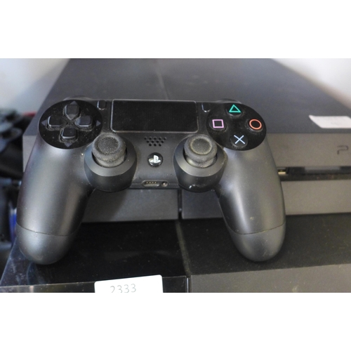 2333 - 2 Sony Playstation 4 consoles with 3 Sony controllers