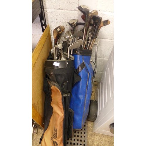 2394 - 2 Bags of golf clubs with 2 trolleys