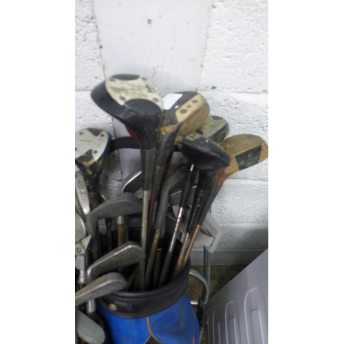 2394 - 2 Bags of golf clubs with 2 trolleys