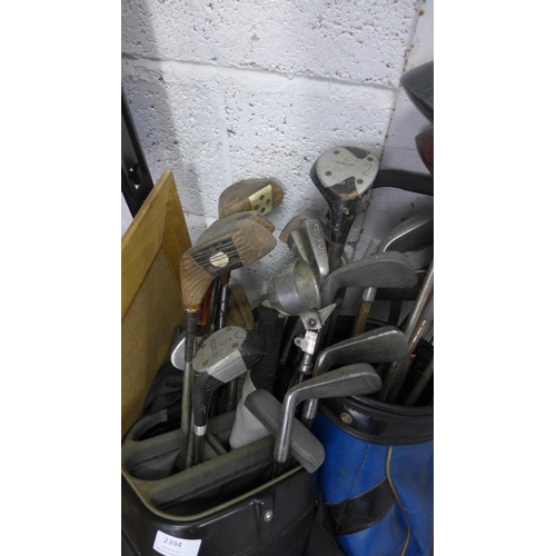 2394 - 2 Bags of golf clubs with 2 trolleys