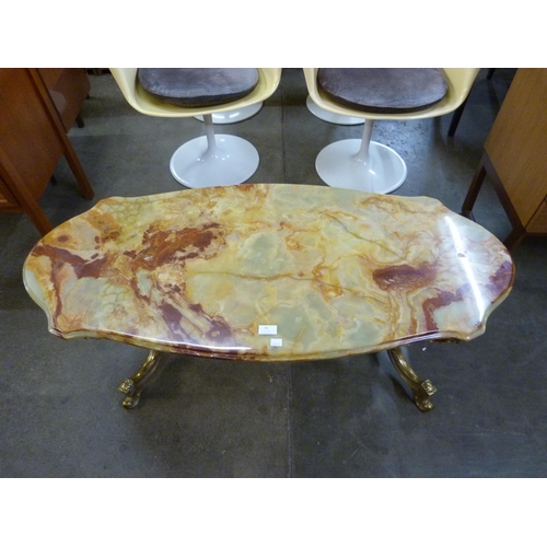 117 - An Italian brass and onyx topped coffee table