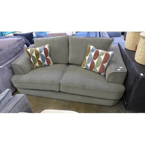 1301 - A khaki upholstered three seater sofa