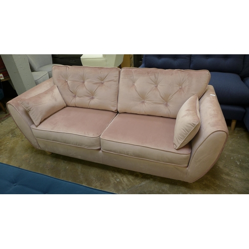 1310 - A pink velvet three seater sofa