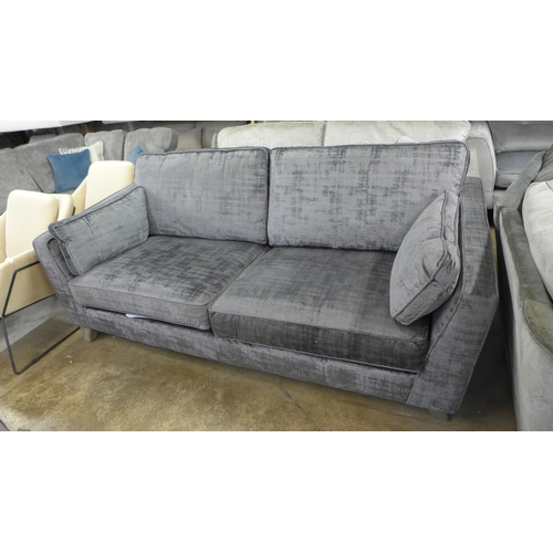 1322 - A charcoal velvet three seater sofa