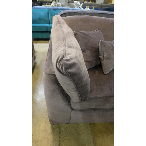 1338 - An aubergine velvet four seater sofa