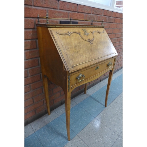 1 - An early 20th Century French walnut, maple and brass mounted bureau de dame