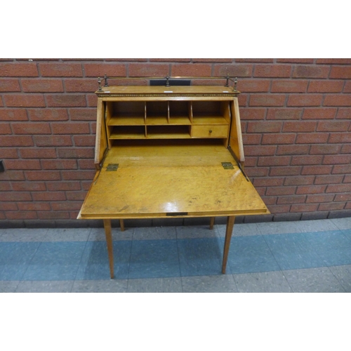 1 - An early 20th Century French walnut, maple and brass mounted bureau de dame