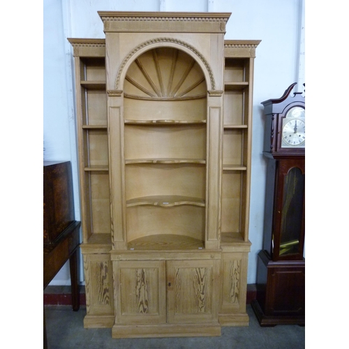 109 - A George III style carved pine architectural library bookcase, 227cms h, 140cms w, 38cms d