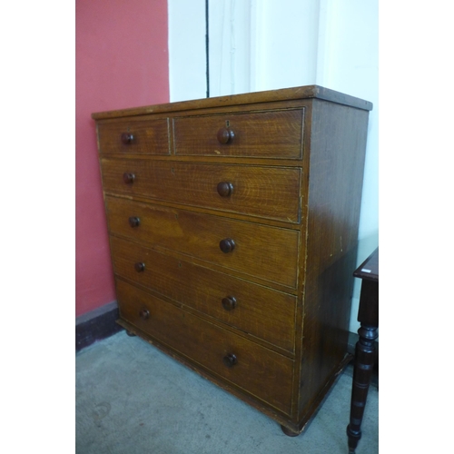 11 - A Victorian scumbled pine chest of drawers