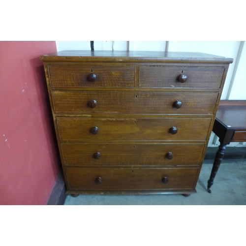 11 - A Victorian scumbled pine chest of drawers