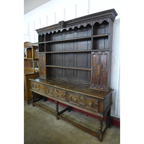 115 - A William III and later oak geometric moulded dresser