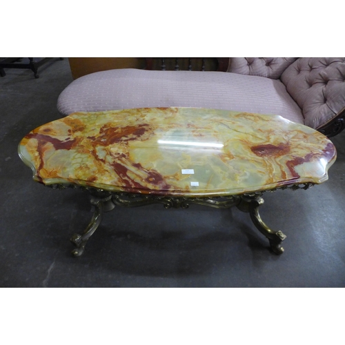 117 - An Italian brass and onyx topped coffee table