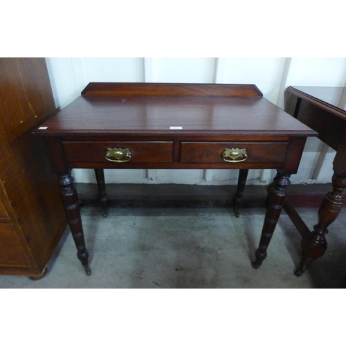 12 - A late Victorian mahogany two drawer writing table