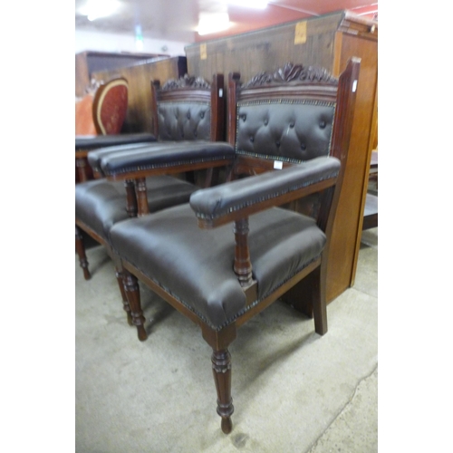 128 - A pair of Victorian carved walnut library chairs