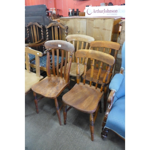 132 - A Harlequin set of four Victorian elm and beech kitchen chairs