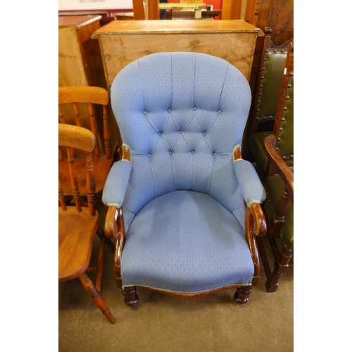 133 - A Victorian mahogany and upholstered open armchair