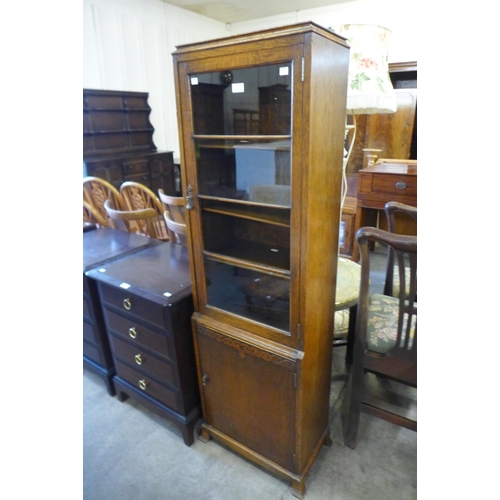 147 - An early 20th Century carved oak two door bookcase