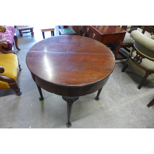 149 - A George III mahogany demi lune fold-over tea table