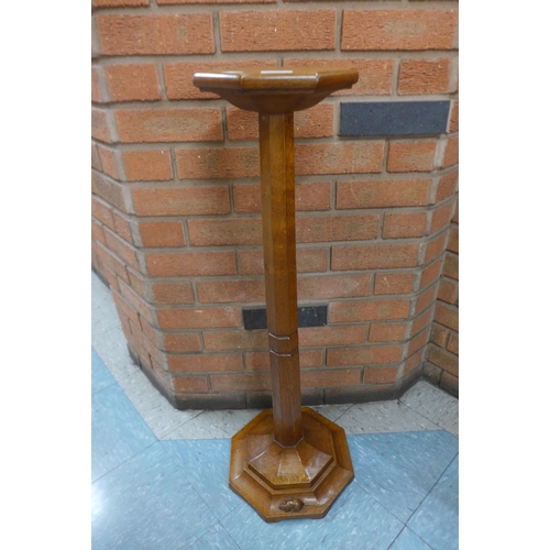 17 - A Mouseman oak jardiniere or candle stand, 91cms h