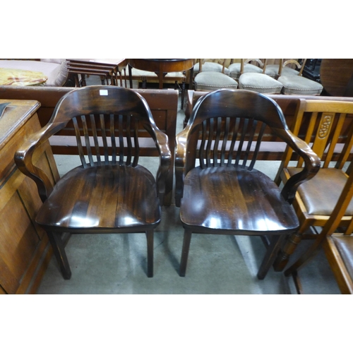 172A - A pair of hardwood Captains desk chairs