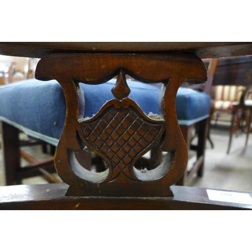 184 - An Edward VII mahogany and fabric upholstered tub chair