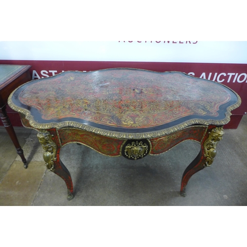 19 - A 19th Century French red Boulle, ebonised and gilt mounted serpentine single drawer centre table, 7... 