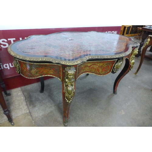 19 - A 19th Century French red Boulle, ebonised and gilt mounted serpentine single drawer centre table, 7... 