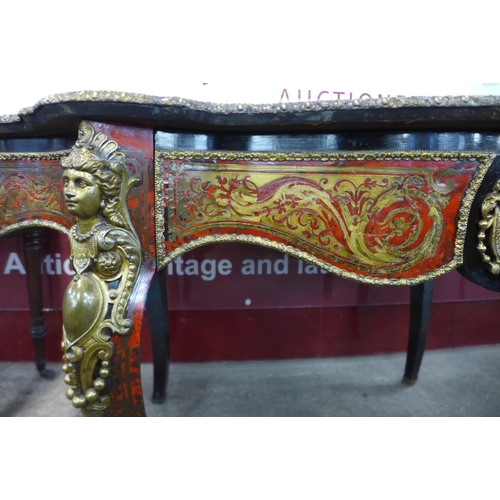 19 - A 19th Century French red Boulle, ebonised and gilt mounted serpentine single drawer centre table, 7... 