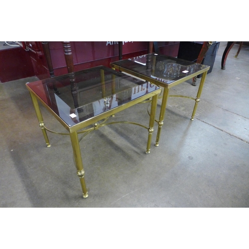 20 - A pair of Italian style brass and glass topped square coffee tables