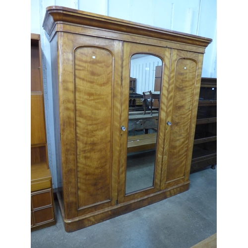 207 - A Victorian satin birch three door wardrobe