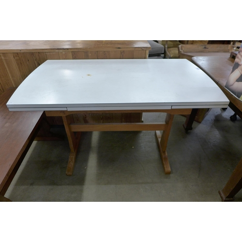 222 - A vintage beech kidney shaped dressing chest and a beech and Formica topped draw-leaf table