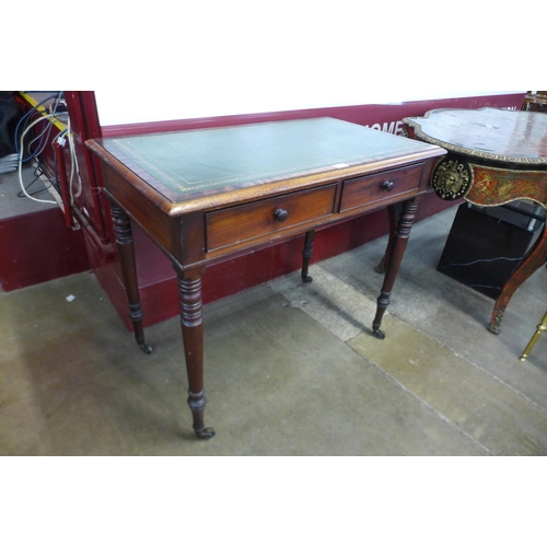 23 - A Victorian mahogany and green leather topped two drawer writing table