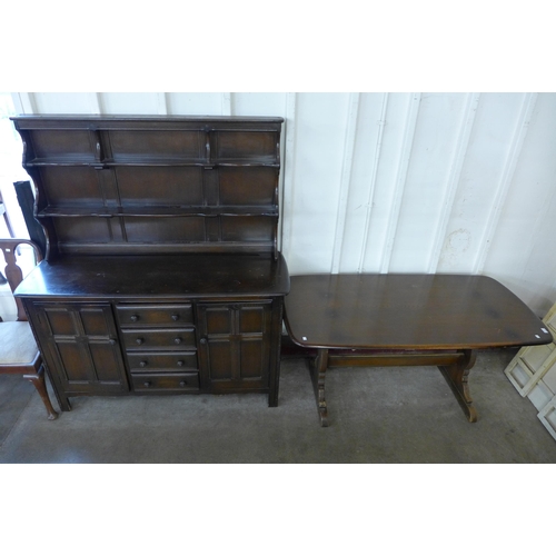 231 - An Ercol Golden Dawn elm refectory table and dresser