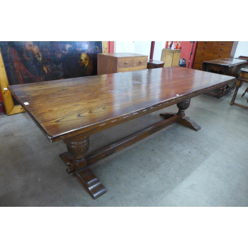 3 - A 17th Century style oak refectory table, 75cms h, 244cms l, 92cms w