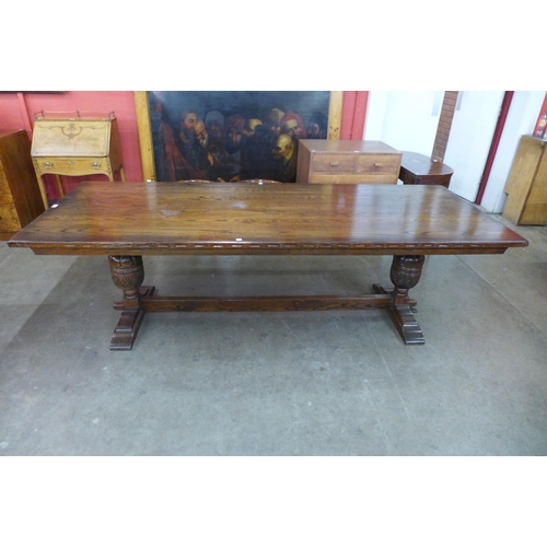 3 - A 17th Century style oak refectory table, 75cms h, 244cms l, 92cms w